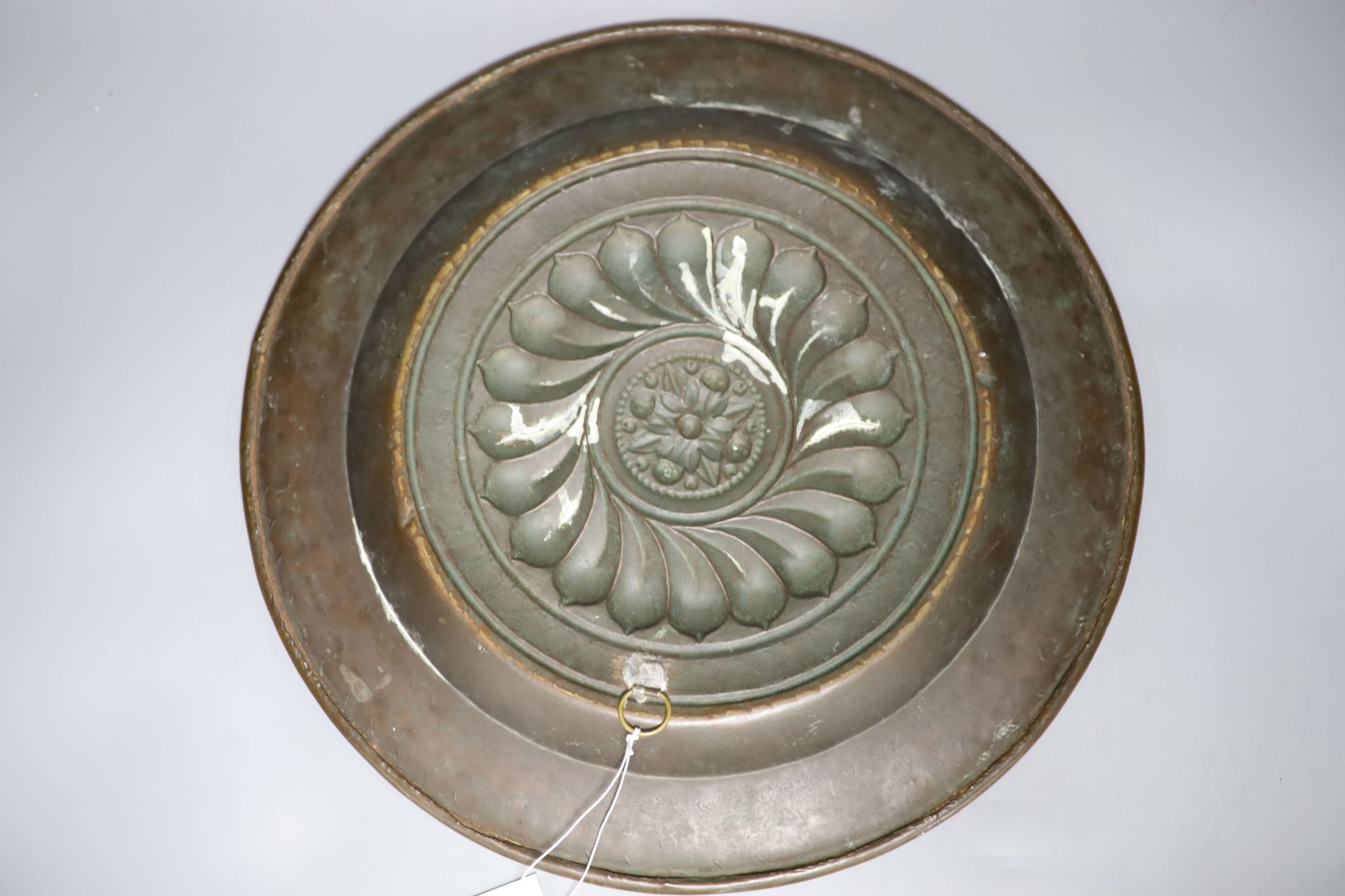 A 17th century Nuremberg brass alms dish, diameter 43cm